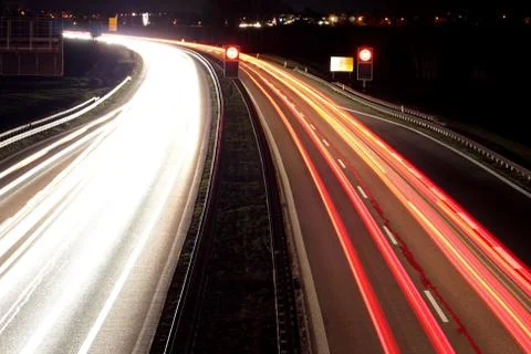 Long exposure of car lights on a freeway in the night. Stock Photos