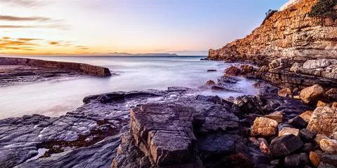 Long Exposure of the Hermanus Old Harbour harbor entrance Stock Photos