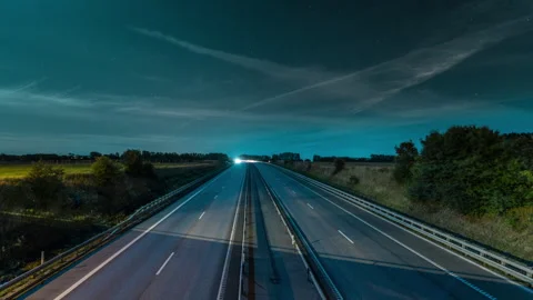 Long Exposure Highway Light Trails Under Starry Night Sky Stock Footage 342446084
