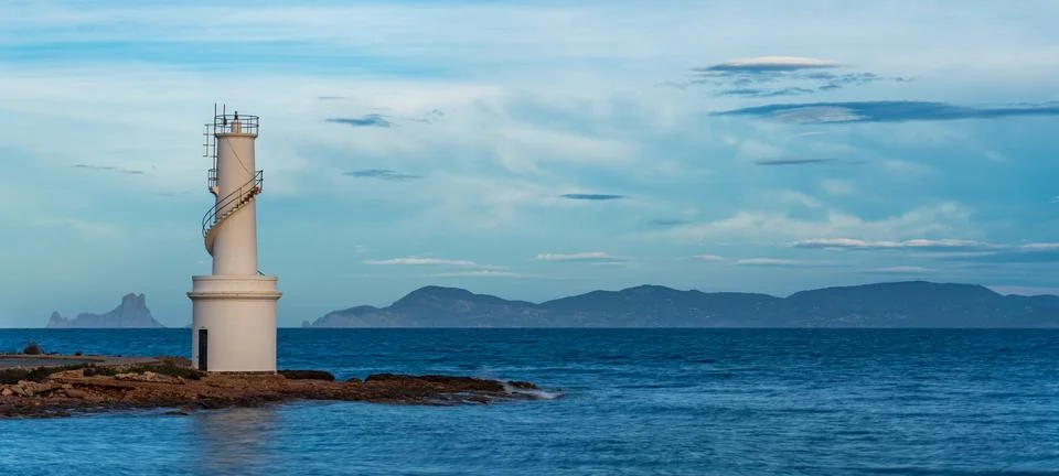 Long Exposure of Ibiza Lighthouse with Es Vedra Island Silhouette Foto stock