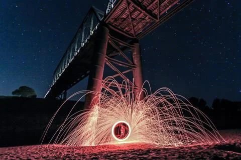 Long exposure image capturing sparks of spinning steel wool Stock Photos