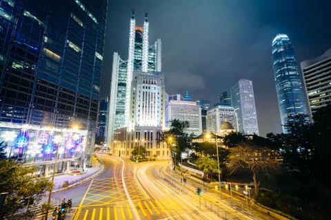 Long exposure of an intersection and modern skyscrapers at night, at Central, Stock Photos