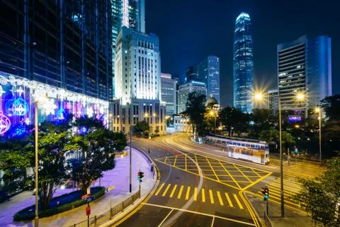 Long exposure of an intersection and modern skyscrapers at night, at Central, Stock Photos