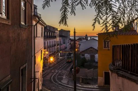 A long exposure with light trails of a cable car in Lisbon at sunrise Stock Photos
