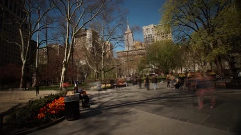 Long Exposure Pan Time-Lapse of Maddison Square Park &amp; The Empire State Building Stock Footage 62566612