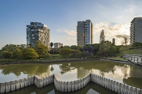 A long exposure of Parc Diagonal Mar and buildings in the background in Barce 스톡 사진