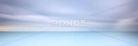 Long exposure photography panorama 3:1 with soft sea and cloudy sky Stock Photos
