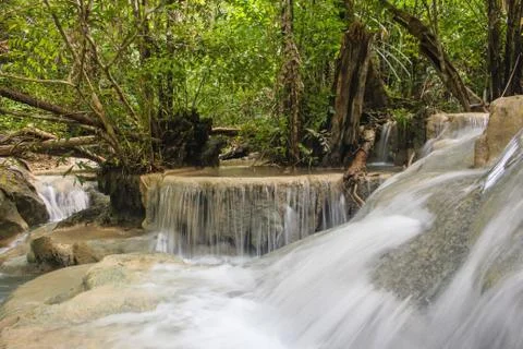 Long exposure of pure flowing water in tropical forest at Erawan National Park Stock Photos