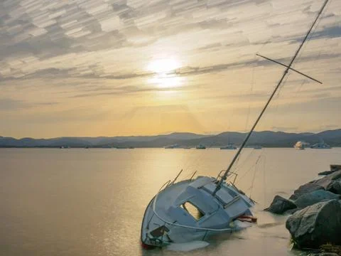 A long exposure shot of a stranded sailing boat  at the port of Saint-Tropez. Stock Photos