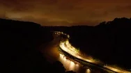 Long Exposure Time Lapse Of Light Trails On Highway At Night In Dark Valley Stock Footage