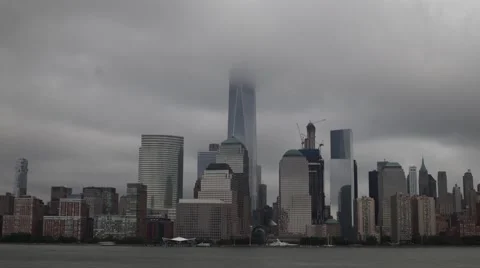 Long Exposure Time-Lapse of Low Clouds passing over the World Trade Center Video stock 64716032