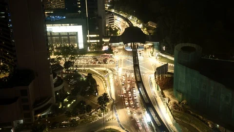 Long exposure time lapse of road junction at night with monorail line above Video stock 91135363