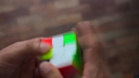 A long exposure time lapse shot of a man solving a rubiks cube  Stock Footage 152051454