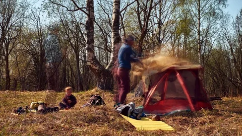 Long exposure timelapse of a family packing tent while trekking in early spring Stock Footage 115016653