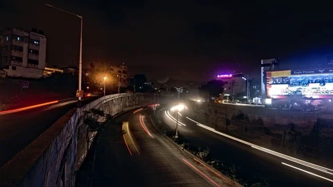 Long exposure timelapse video of traffic entering an underpass, Bangalore city Stock Footage 88245454