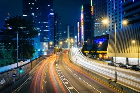 Long exposure of traffic on Connaught Road and skyscrapers at night, in Hong  Stock Photos