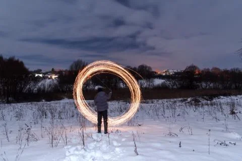 Long exposure. Yellow fire lines. Nightly winter landscape. Stock Photos