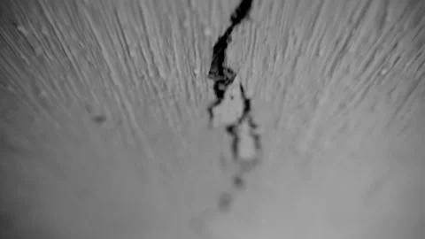 A long, fast-moving crack in the ceiling close-up with a blurred background Stock Footage 205903387