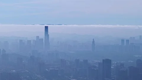 Long focus compression modern buildings and wind energy mountains Stock Footage 311750235