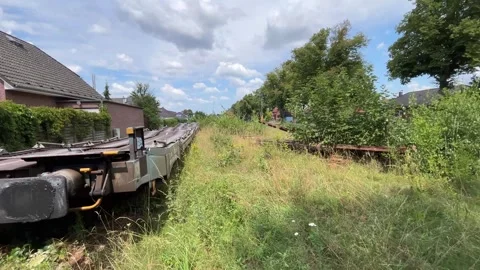Long Freight Train Along Railway Tracks in Germany Stock Footage 340809048