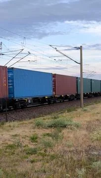 Long freight train with containers at sunset Stock Photos