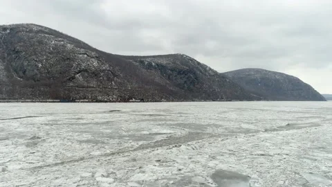 Long Freight Train Travels Between Frozen River/ Mountain-Hudson Valley New York Stock Footage 170520689