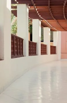 Long gallery corridor with columns in perspective Stock Photos