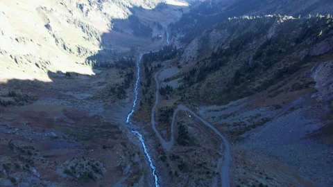 A long gorge with a mountain river and a forest Vídeos de archivo 215635798