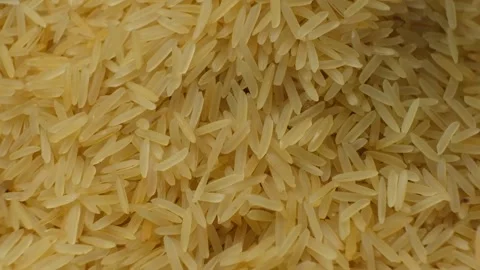Long grain parboiled basmati rice pouring macro slow motion 스톡 동영상 268440656