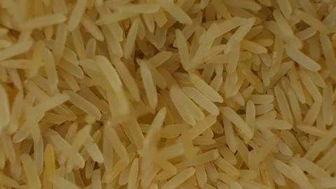 Long grain parboiled basmati rice pouring macro slow motion Stock Footage 269679953