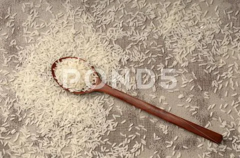 Long Grain Rice With A Wooden Spoon