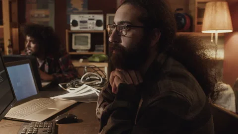 Long Haired Bearded Tech Lover Coding on Computer in Dark Room Video stock 263299248
