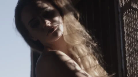 Long haired beautiful brunette model poses in slow motion Video stock 45819290