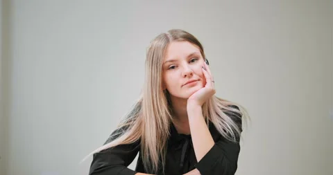 Long haired blonde in black blouse at online lecture Stock Footage 146255164