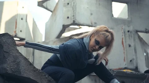 Long-haired blonde dancing on the ruins. Stock Footage 141114214