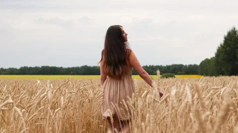 Long haired brunette turns her head to the camera. Stock Footage 285387767