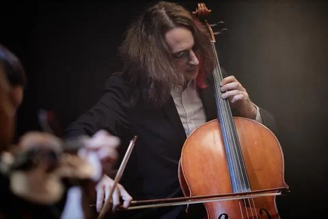 Long haired Cello Player Performing Chamber Music Stock Photos