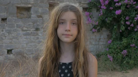 Long haired girl is looking forward. Zoom in. Old Bar, Montenegro Video stock 100988634