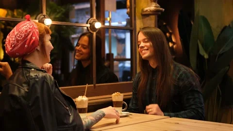 Long-haired handsome man talking to a red-haired girl he just met on a blind  Stock Footage 217345776