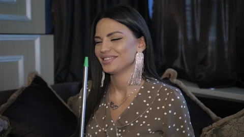 Long haired lady with designer silver earrings smokes hookah Stock Footage 140408621