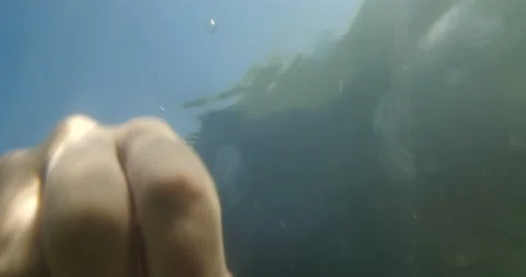 Long-haired man in black clothes falls into the water and drowns Stock Footage 145922774