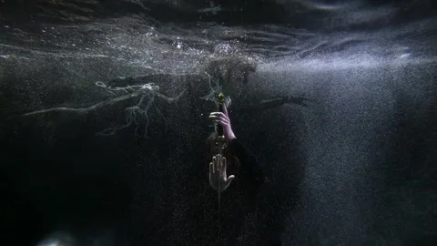 The long-haired man bowed before the sword. a woman with pearl beads hovers 스톡 동영상 200809453