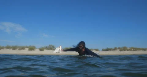Long-haired man in dark clothes quickly runs into the sea to drown Video stock 145922733