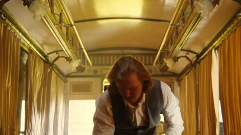 A long haired man preparing the table for a date Stock Footage 259587596