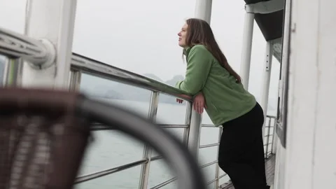 Long haired woman standing on deck of ship. Stock Footage 305368215
