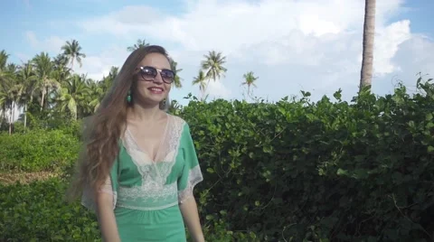 Long-Haired Young Woman in Sunglasses Walking Outdoors. Slow Motion Stock Footage 59158137