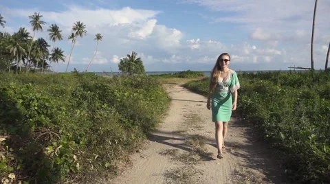 Long-Haired Young Woman in Sunglasses Walking Outdoors. Slow Motion Stock Footage 59158182