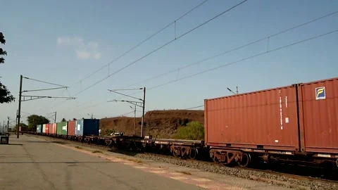 Long Half Empty Freight cargo container Indian rail Train Moving Station India Stock Footage 153696191