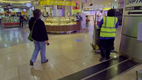 A long hallway with a clock on the wall Stock Footage 291928186