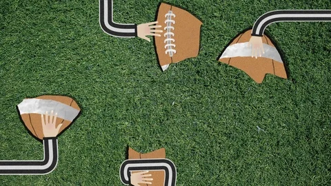 Long Hand Assembling a Football Cutout Retro Style Stock Footage 103186549